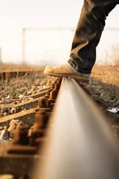 Stepping over the train tracks Stock Photos