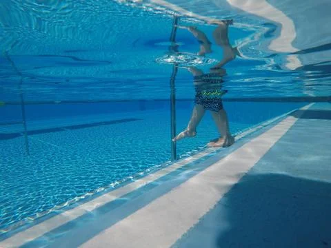 Stepping into the pool Stock Photos