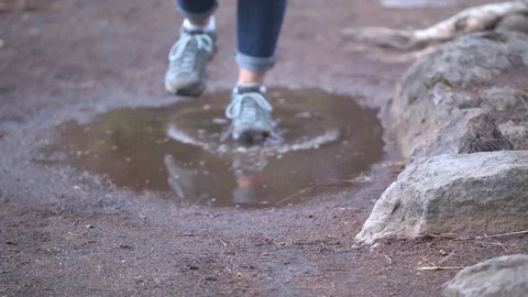 Stepping in a Puddle Stock Footage 90494136