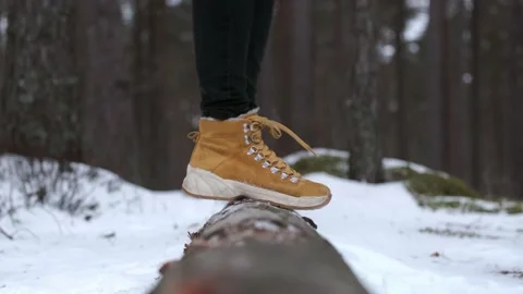Stepping on a tree in a winter forest Видео 233929154