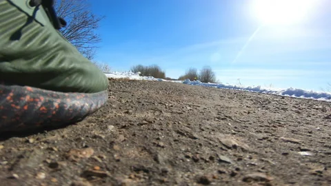 Steps along the road. The man is walking. Stroll . Footwear. Leisure . Legs . Stock Footage 88664301