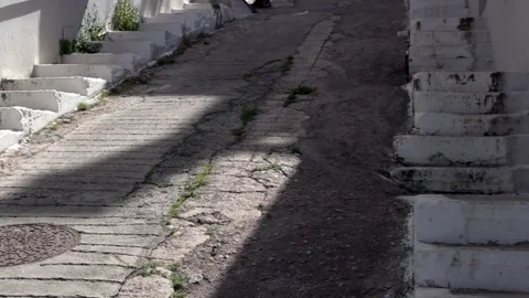 Steps and path leading up between Greek houses Video stock 85299402