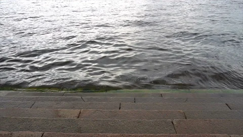 The steps are washed by the river Stock Footage 94053006