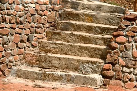 Steps between Rubble Walls Stock Photos
