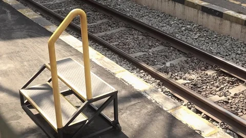  A steps for boarding and disembarking train passengers on the station platform Stock Footage 289601898