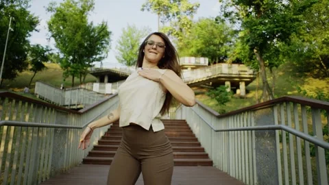The steps of the city become a dance stage for a woman. Stock Footage 247635320