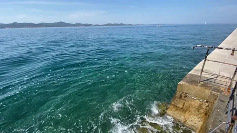 Steps into the clear warm waters of the Adriatic Sea Stockbeeldmateriaal 160760267