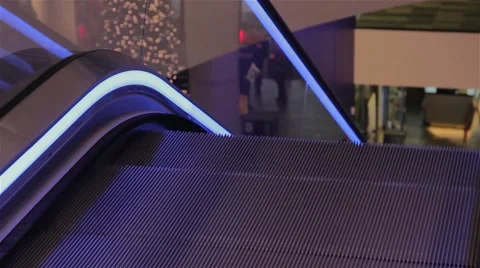 Steps Disappear Down Escalators Lined with Blue Lights at Birmingham Library 動画素材 44525110