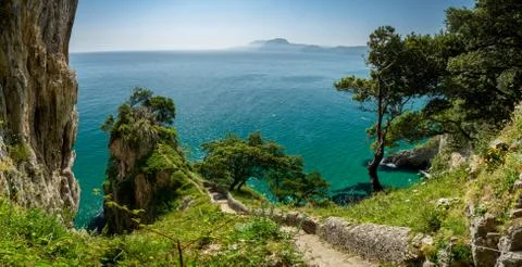 Steps down to El Caballo lighthouse in Cantabria, panorama 스톡 사진