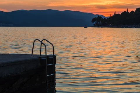 Steps down in the golden waters Stock Photos