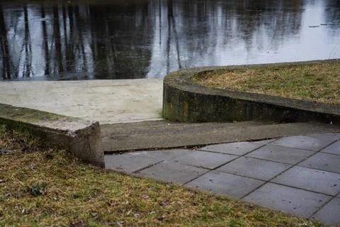 Steps down to the pier and the river. Frozen river Stock Photos