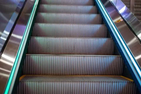 Steps of a gray escalator without people Stock Photos