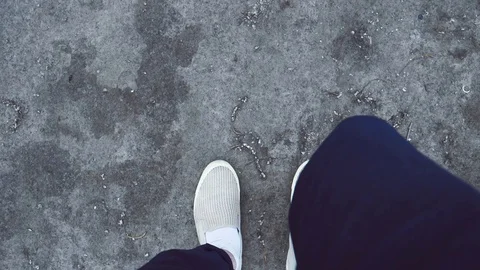 Steps guy on top of white sneakers 180 FPS Stock Footage 76992514
