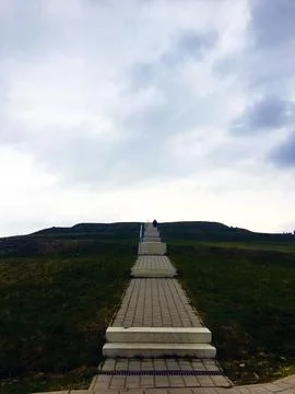 Steps that lead up a hill	 Stock Photos