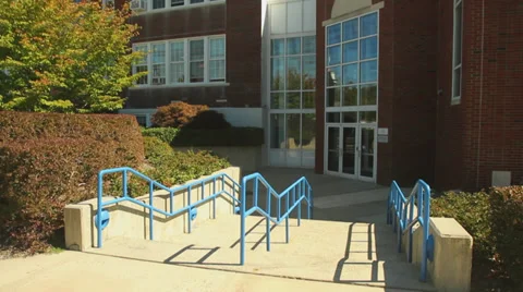 Steps leading to a brick school Stock Footage 32448636