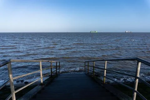 Steps leading into the ocean Stock Photos