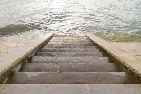 Steps leading into sea. Stock Photos