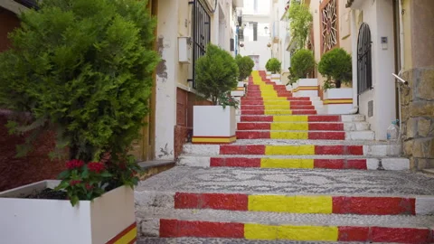 Steps Leading Through Old Town Painted In Vibrant Spanish Flag Colours Stock Footage 254861359