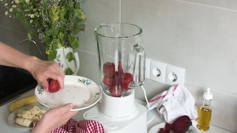 Steps to make homemade ice cream using strawberries, bananas, and beets are.. Stock-Footage 338408063