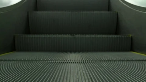 Steps of a moving up escalator Stock Footage 73964737