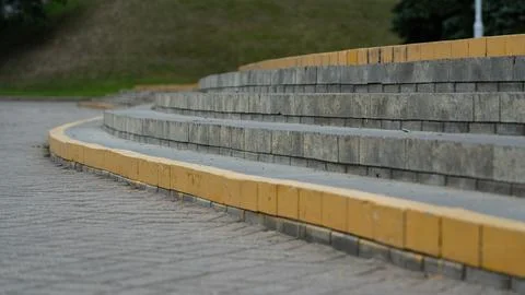 The steps in the park, the edges are painted yellow Stock Photos