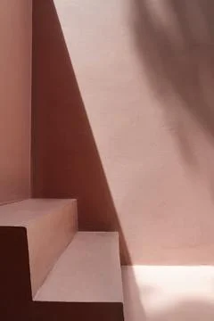 Steps by a pink wall with shadows Stock Photos