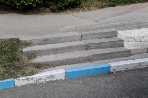 Steps on the sidewalk. Concrete steps in park. Stock Photos