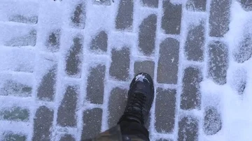 Steps on the snow, the frost steps through the snow, cold winter, walking on sno Stockbeeldmateriaal 85611007