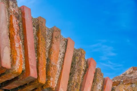Steps of textured bricks against a clear blue sky during daylight Stock Photos
