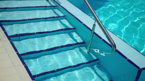 Steps in the water into swimming pool Stock-Footage 64353700