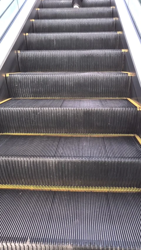 Steps of a working escalator in a subway or shopping mall Stock-Footage 300595721