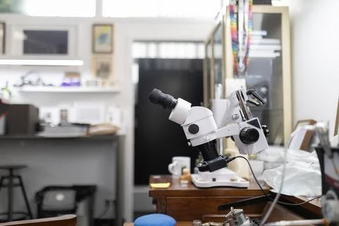 Stereo microscope on workbench in professional workshop Stock Photos