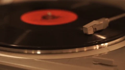 Stereo turntable record player with spinning vintage vinyl disc playing music Stock-Footage 107777636