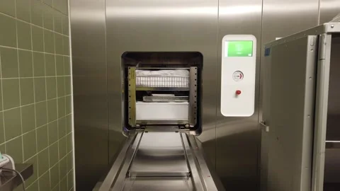Sterile instruments are automatically discharged from a steam sterilizer Stock Footage 134072766