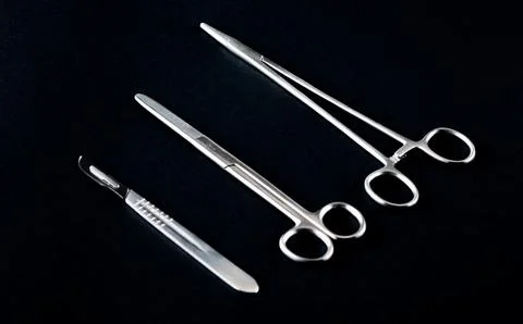 Sterile instruments on a black background close-up. Preparing instruments f.. Stock Photos