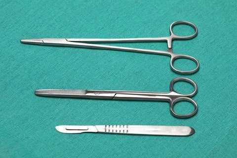 Sterile instruments on a green background close-up. Preparing instruments for Stock Photos