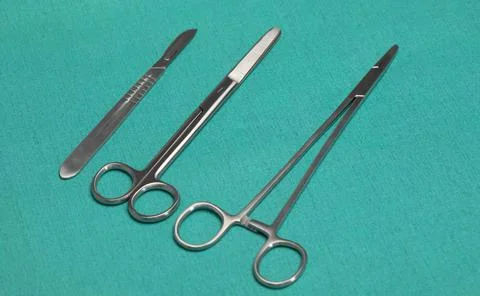 Sterile instruments on a green background close-up. Preparing instruments for Stock Photos