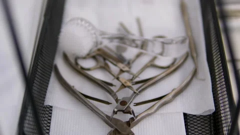 Sterile professional manicure tools on tray prepared for nail care procedure at Stock Footage 302594562