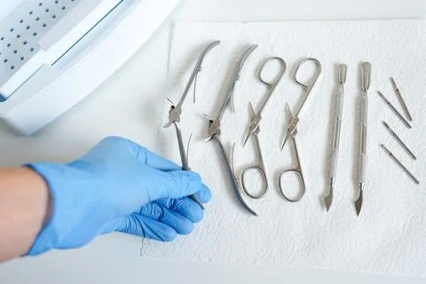 Sterilization of manicure tools with gloves Stock Photos