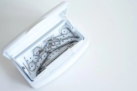 Sterilization of manicure tools in a sterilizer Stock Photos