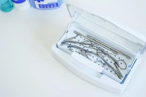 Sterilization of manicure tools in a sterilizer Stock Photos