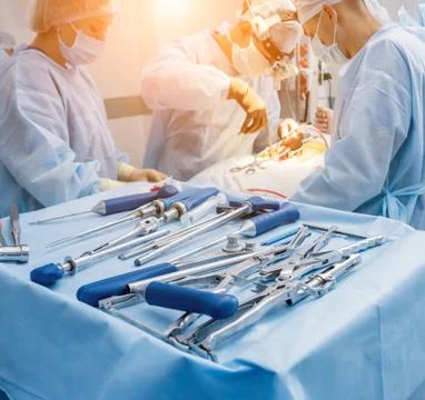 Sterilized surgical instruments and tools on the blue table. Stock Photos