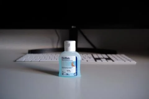 Sterillium in front of a Workspace Stock Photos