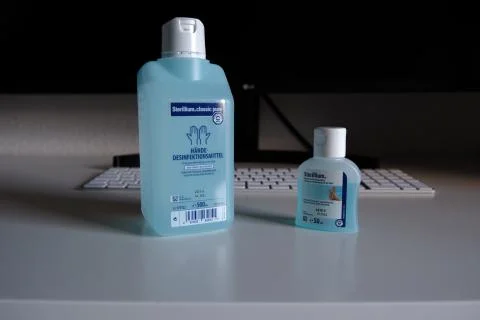 Sterillium in front on Workspace Stock Photos
