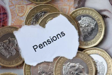 Sterling bank notes and pound coins with the words Pensions Stock Photos