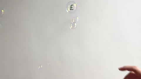Sterling pound symbol bubble falls slowly and bursts 4k Stock Footage 244546799