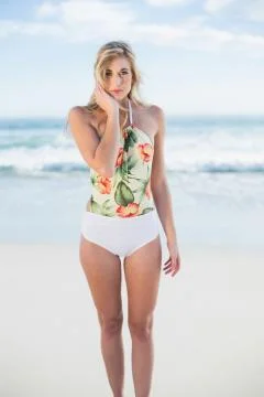 Stern blonde model in swimsuit posing looking at camera Stock Photos