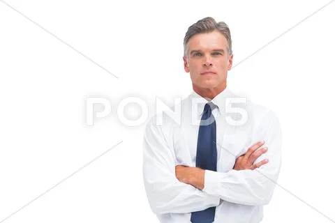 Stern businessman with crossed arms Stock Photos