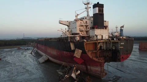 Stern of a damaged ship on the beach at a ship breaking yard in Bangladesh Stock Footage 327166130