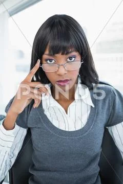 Stern gorgeous businesswoman posing Stock Photos